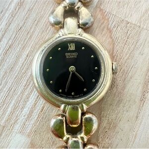 Vintage Seiko ladies black dial gold tone bracelet dress watch NEW BATTERY